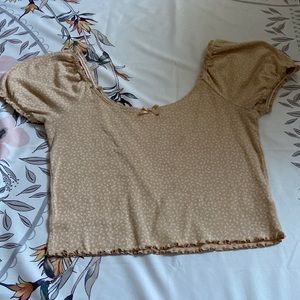 Yellow blouse off the shoulder, roughly sleeves and bottom, white tiny flowers